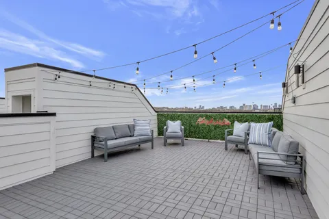 a view of a patio with furniture