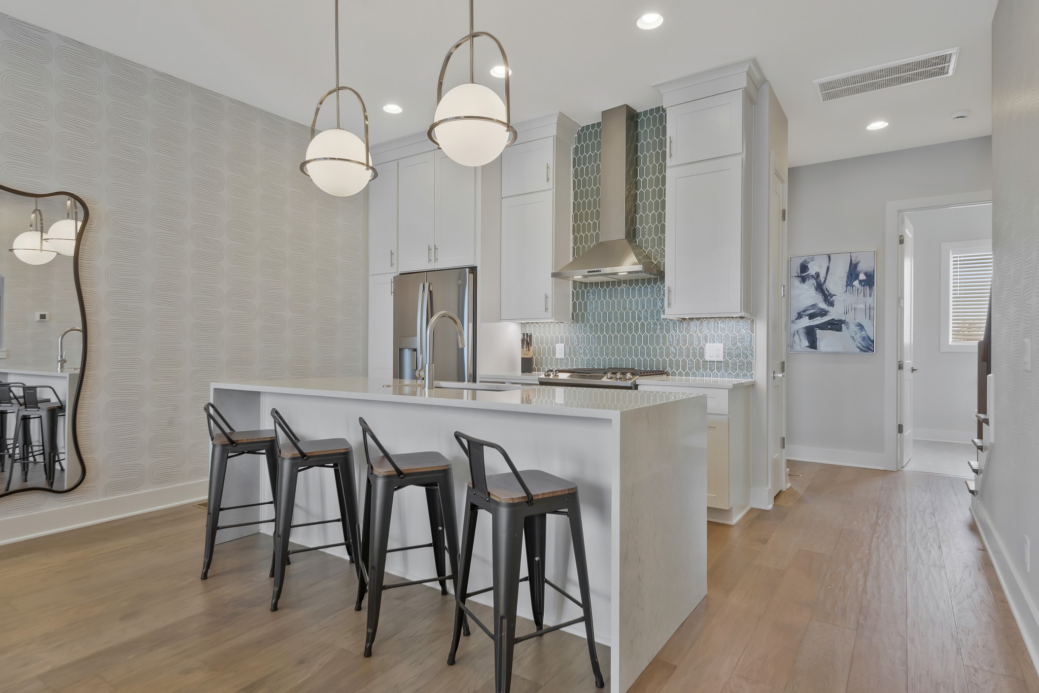 2176 Carson Street, Unit 3 Nashville, TN 37211 - Photo 7 of 44 a kitchen with stainless steel appliances granite countertop a table chairs in it and wooden floors
