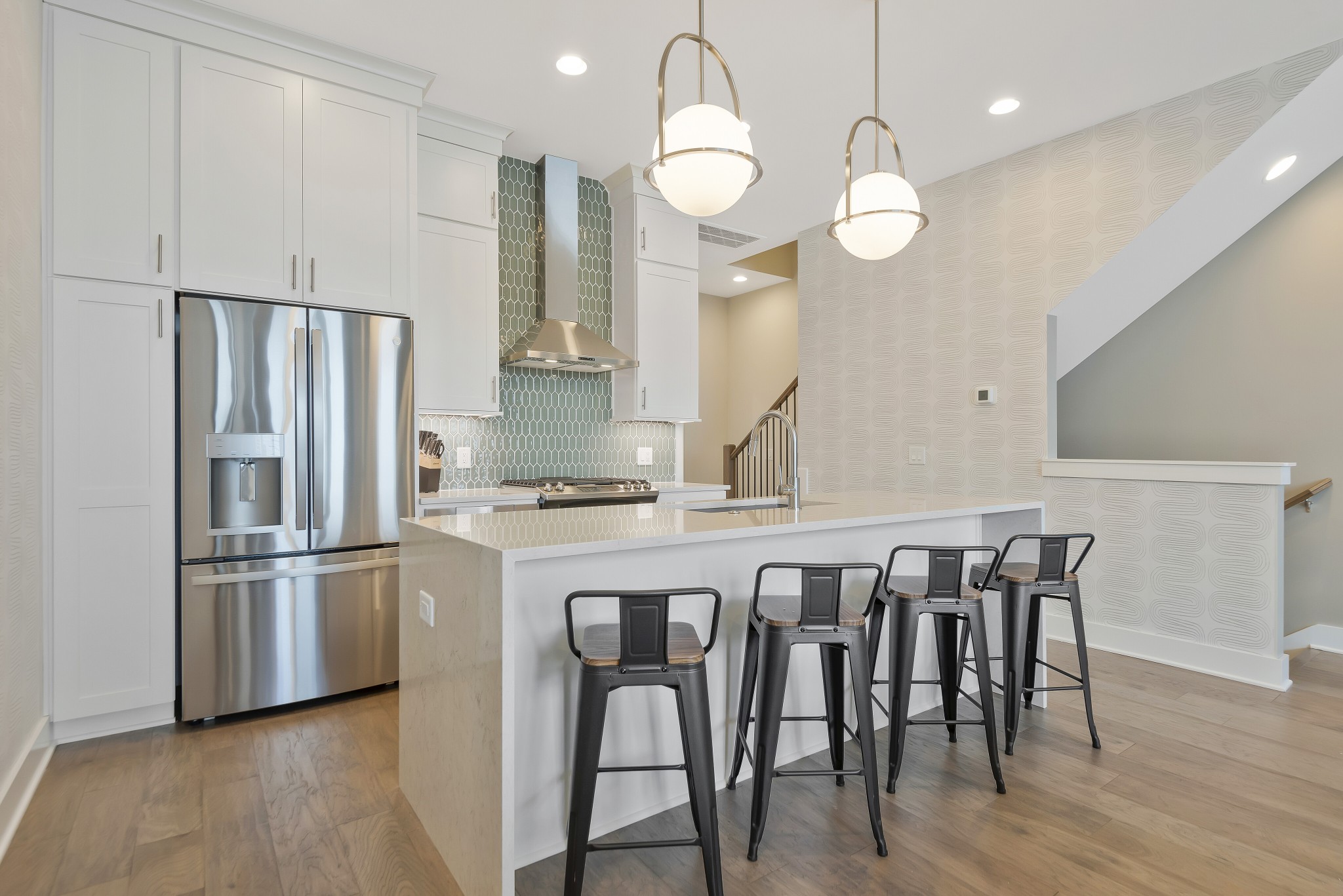 2176 Carson Street, Unit 3 Nashville, TN 37211 - Photo 8 of 44 a kitchen with granite countertop a table chairs stainless steel appliances and wooden floor