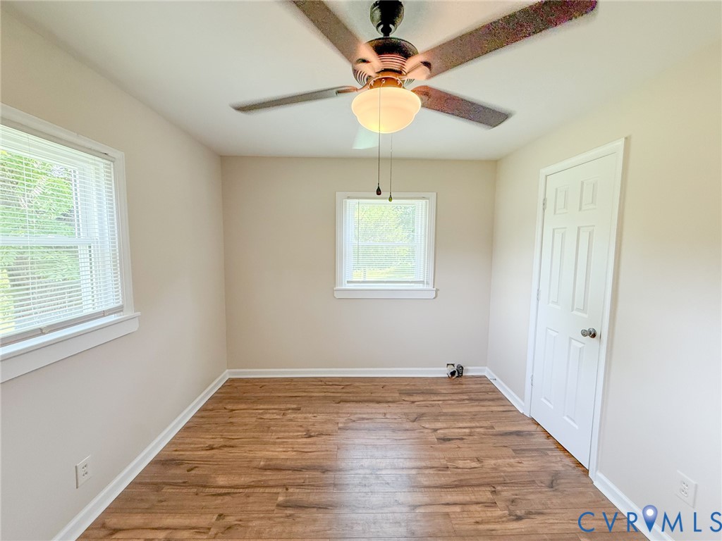 7798 West Courthouse Road Burkeville, VA 23922 - Photo 11 of 23 Room featuring wood-finish flooring, two windows w