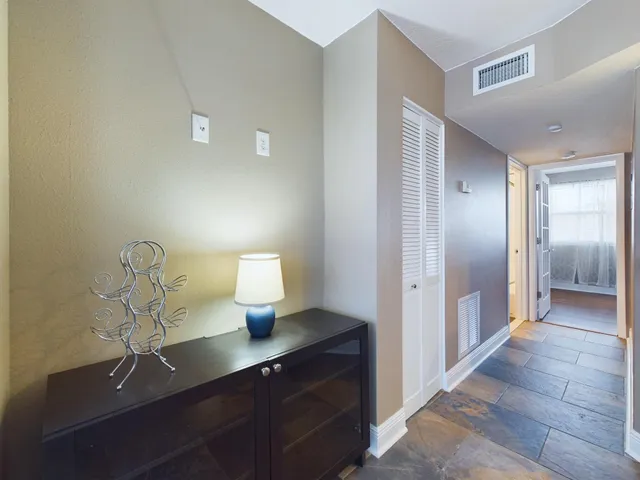 a kitchen with a sink and a mirror