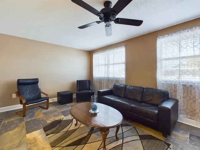 a living room with furniture and a window