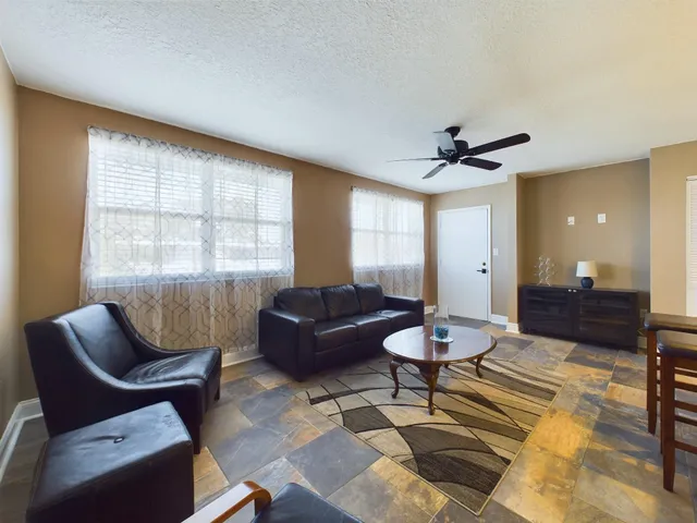 a living room with furniture and a window