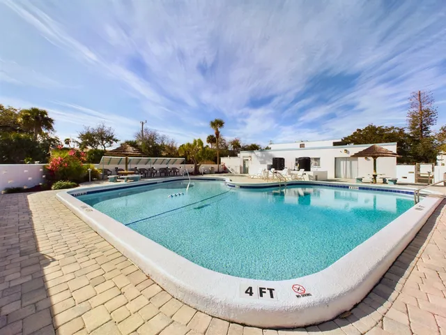 a view of a swimming pool with a patio