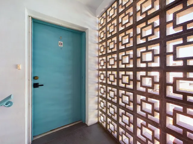 a view of walk in closet and window