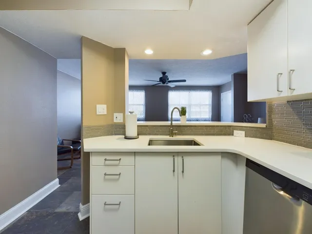 a kitchen with a sink and cabinets