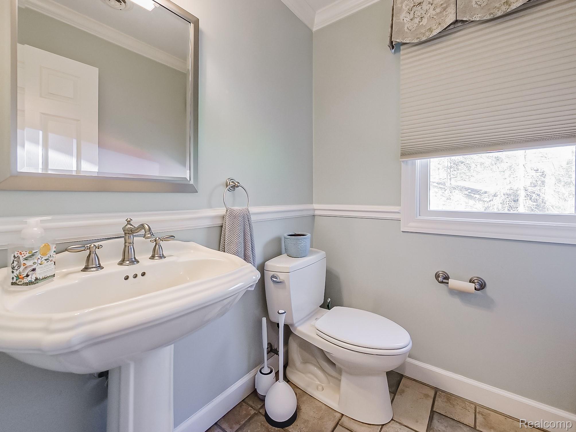3720 East Clarkston Road Oakland, MI 48363 - Photo 39 of 60 Bathroom with crown molding and baseboards
