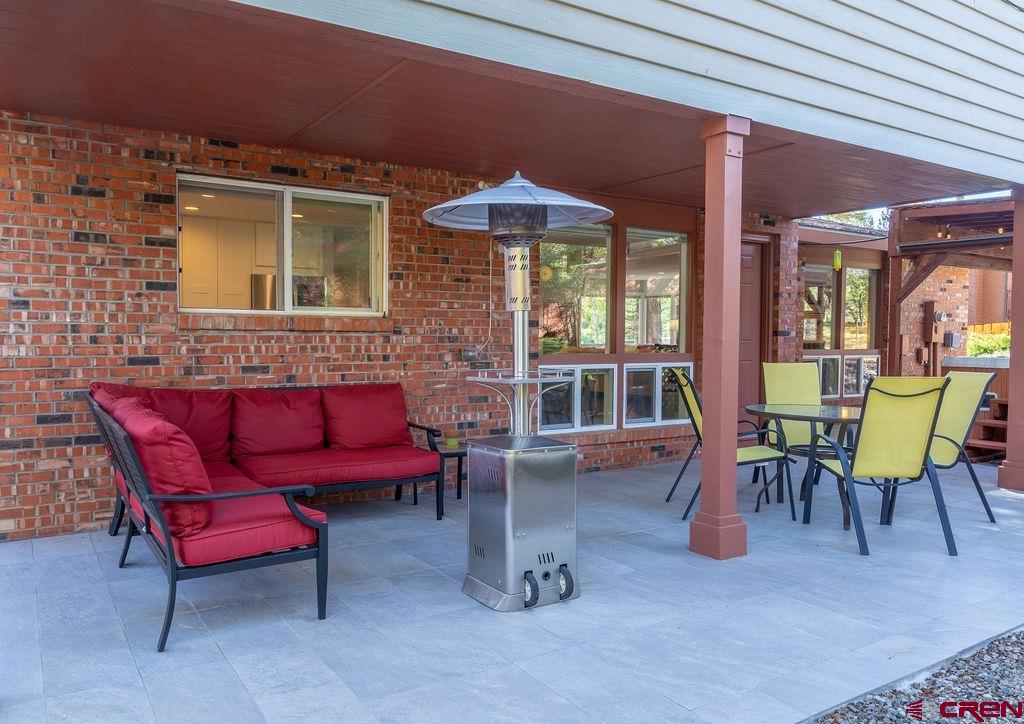 269 Fir Drive Durango, CO 81301 - Photo 11 of 23 a view of a patio with a table and chairs