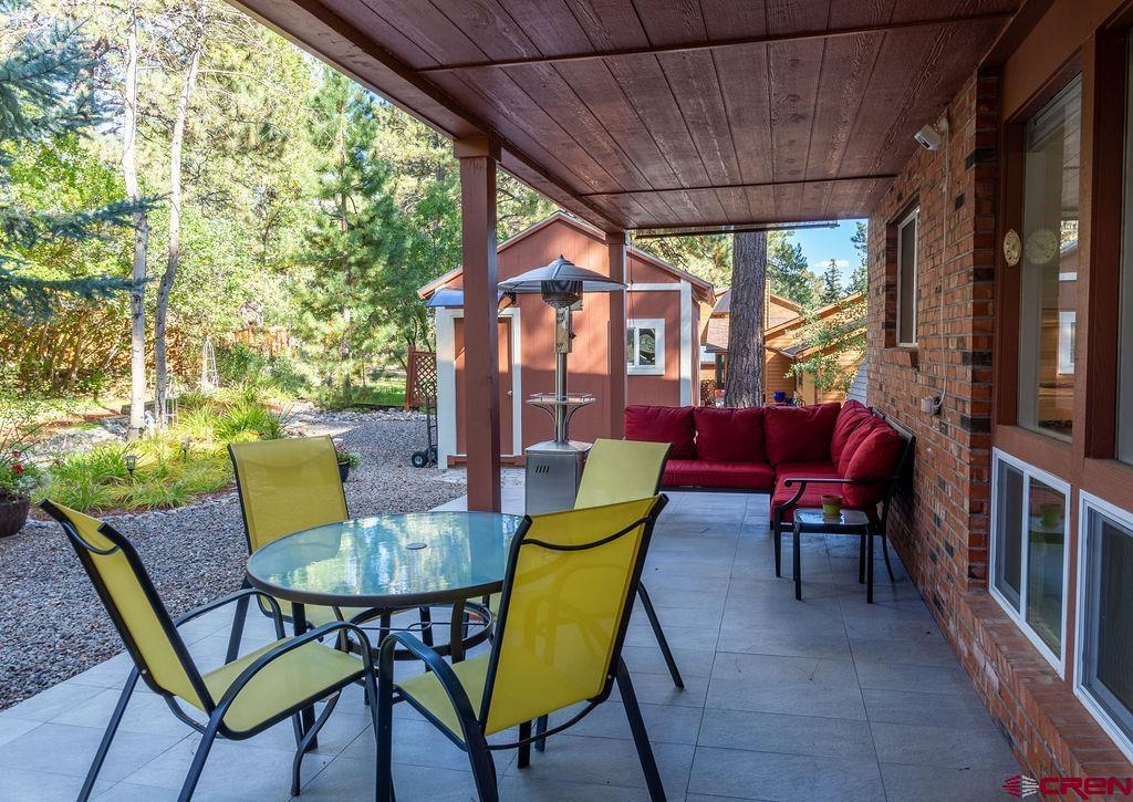 269 Fir Drive Durango, CO 81301 - Photo 12 of 23 a view of an outdoor dining space with furniture and umbrella