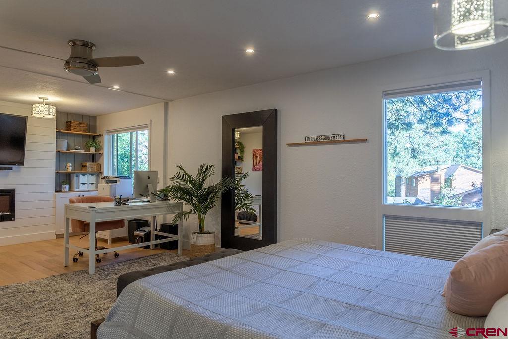 269 Fir Drive Durango, CO 81301 - Photo 13 of 23 a bedroom with a bed and a large window
