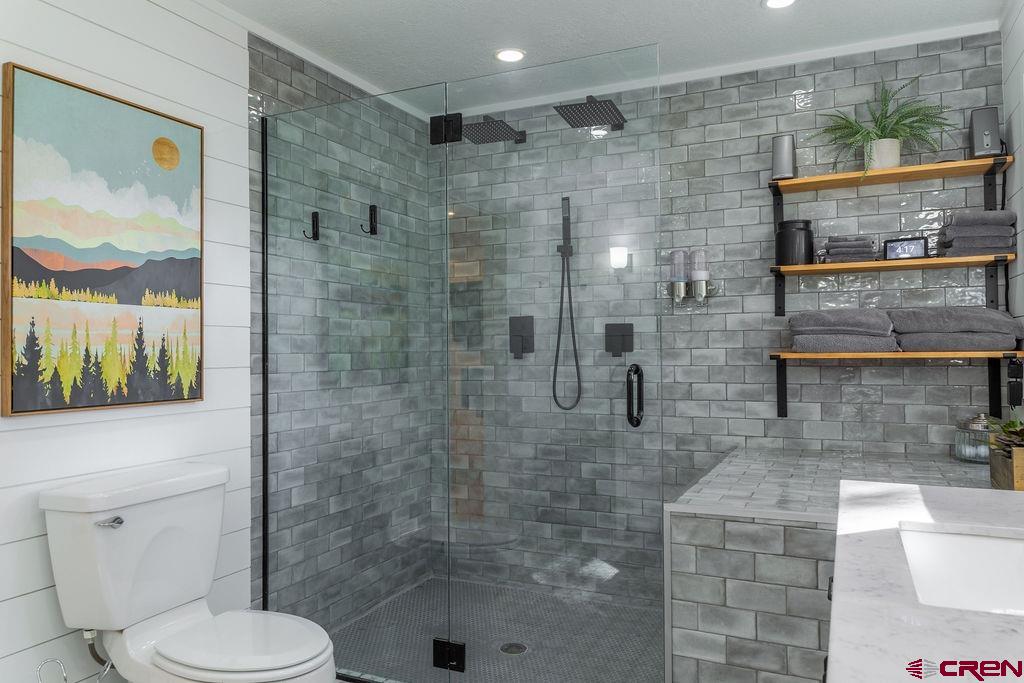 269 Fir Drive Durango, CO 81301 - Photo 14 of 23 a bathroom with a toilet and a shower