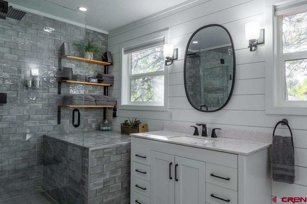 269 Fir Drive Durango, CO 81301 - Photo 15 of 23 a bathroom with a sink double vanity and a mirror