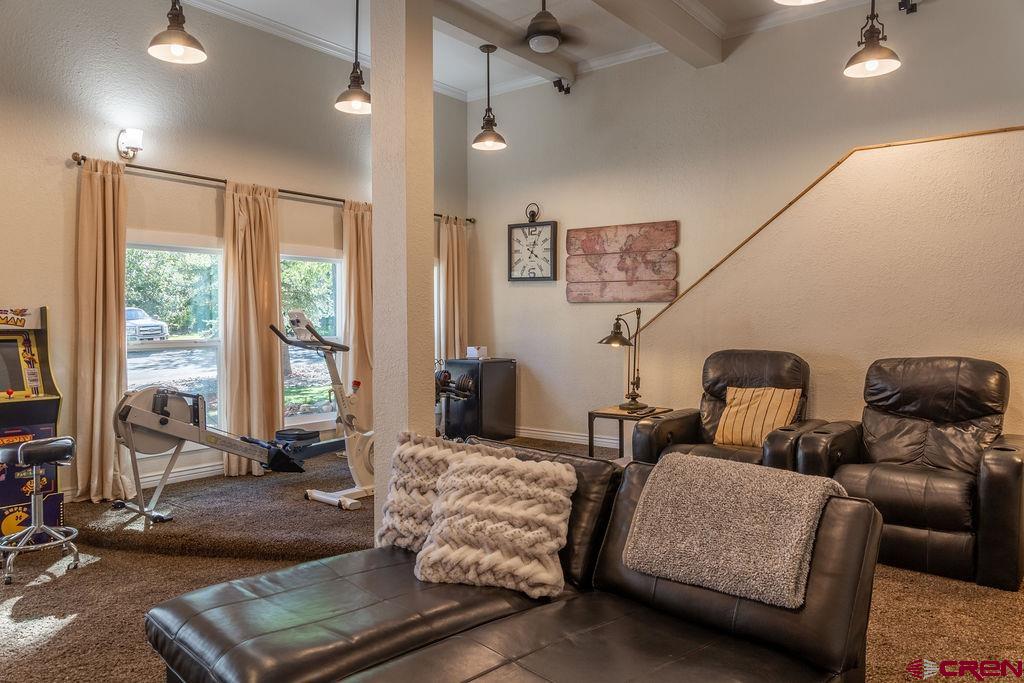 269 Fir Drive Durango, CO 81301 - Photo 20 of 23 a living room with furniture and a floor to ceiling window