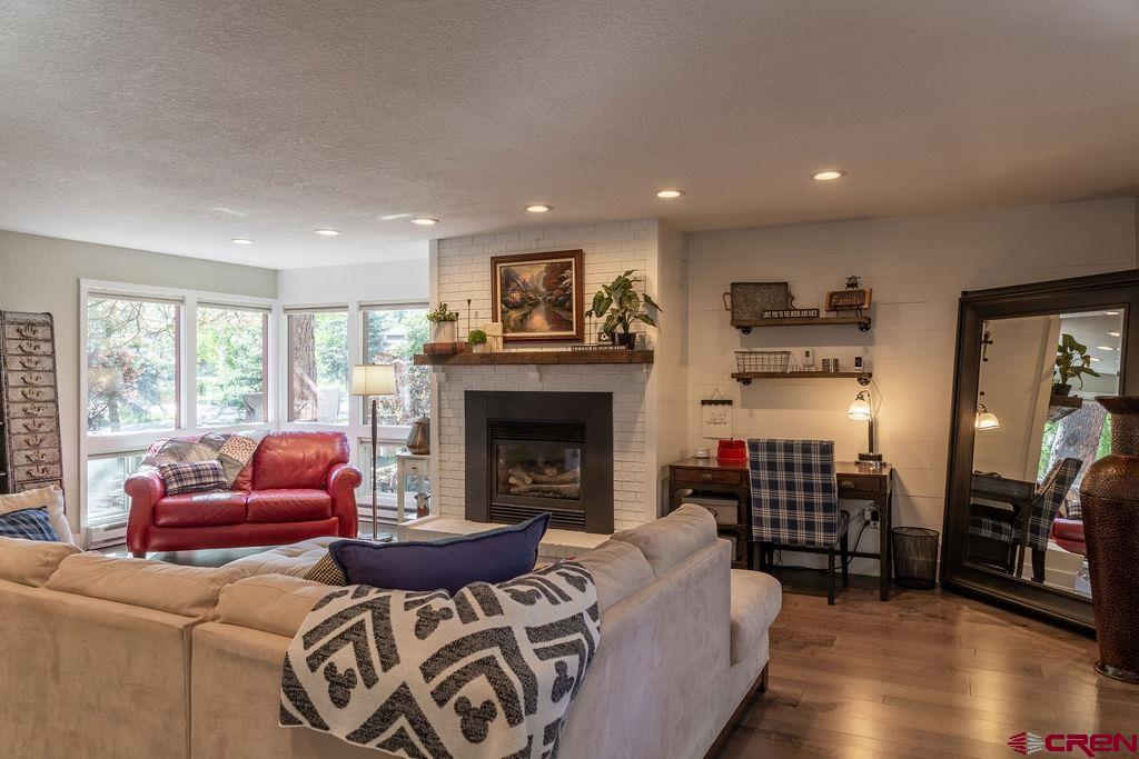 269 Fir Drive Durango, CO 81301 - Photo 2 of 23 a living room with furniture and a fireplace