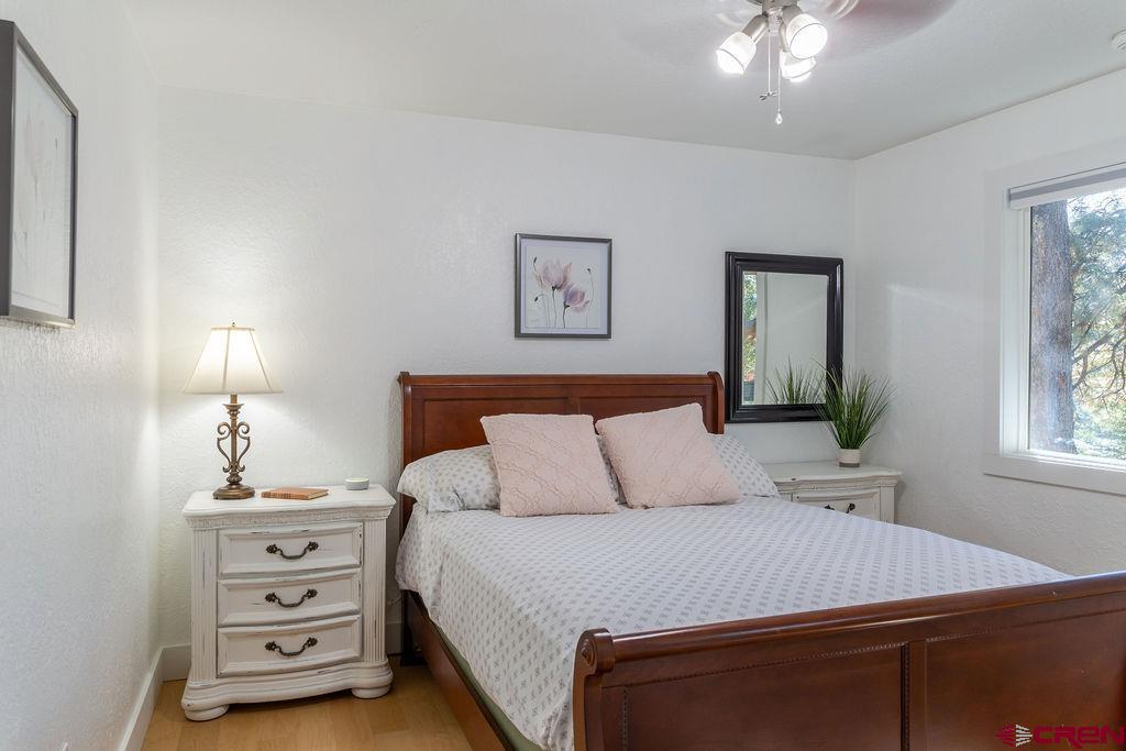269 Fir Drive Durango, CO 81301 - Photo 21 of 23 a bedroom with a bed and a lamp on dresser