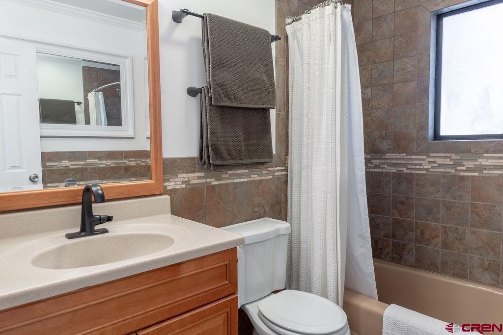 269 Fir Drive Durango, CO 81301 - Photo 23 of 23 a bathroom with a sink a toilet and shower
