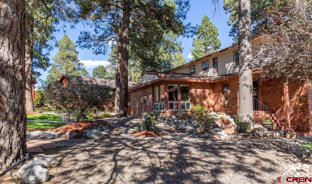 269 Fir Drive Durango, CO 81301 - Photo 8 of 23 a view of a house with a tree in the background