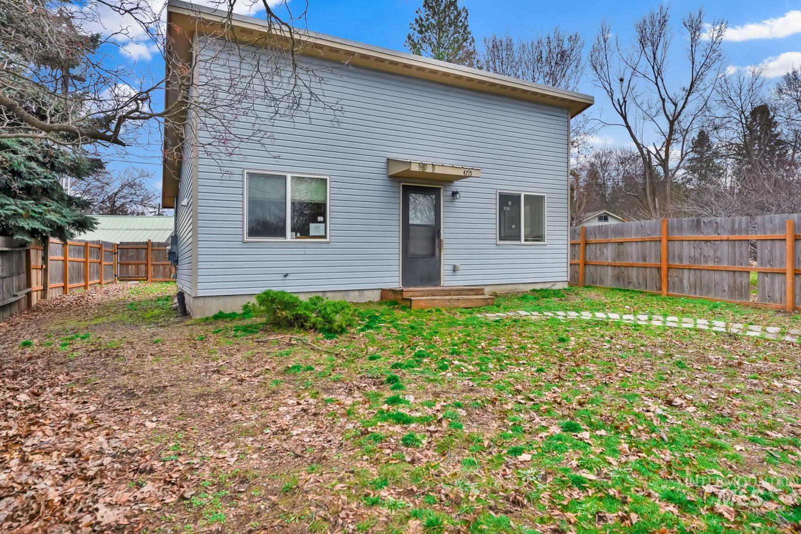 4715 West Reeves Street Coeur D'Alene, ID 83814 - Photo 1 of 24 Back of property with a fenced backyard