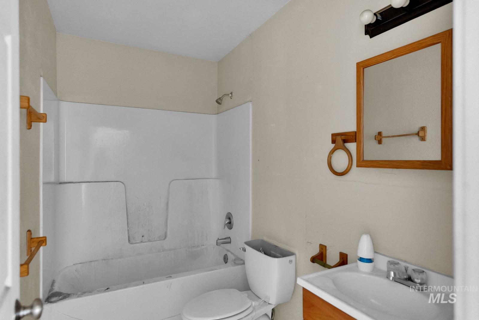 4715 West Reeves Street Coeur D'Alene, ID 83814 - Photo 16 of 24 Bathroom featuring vanity and shower / tub combination