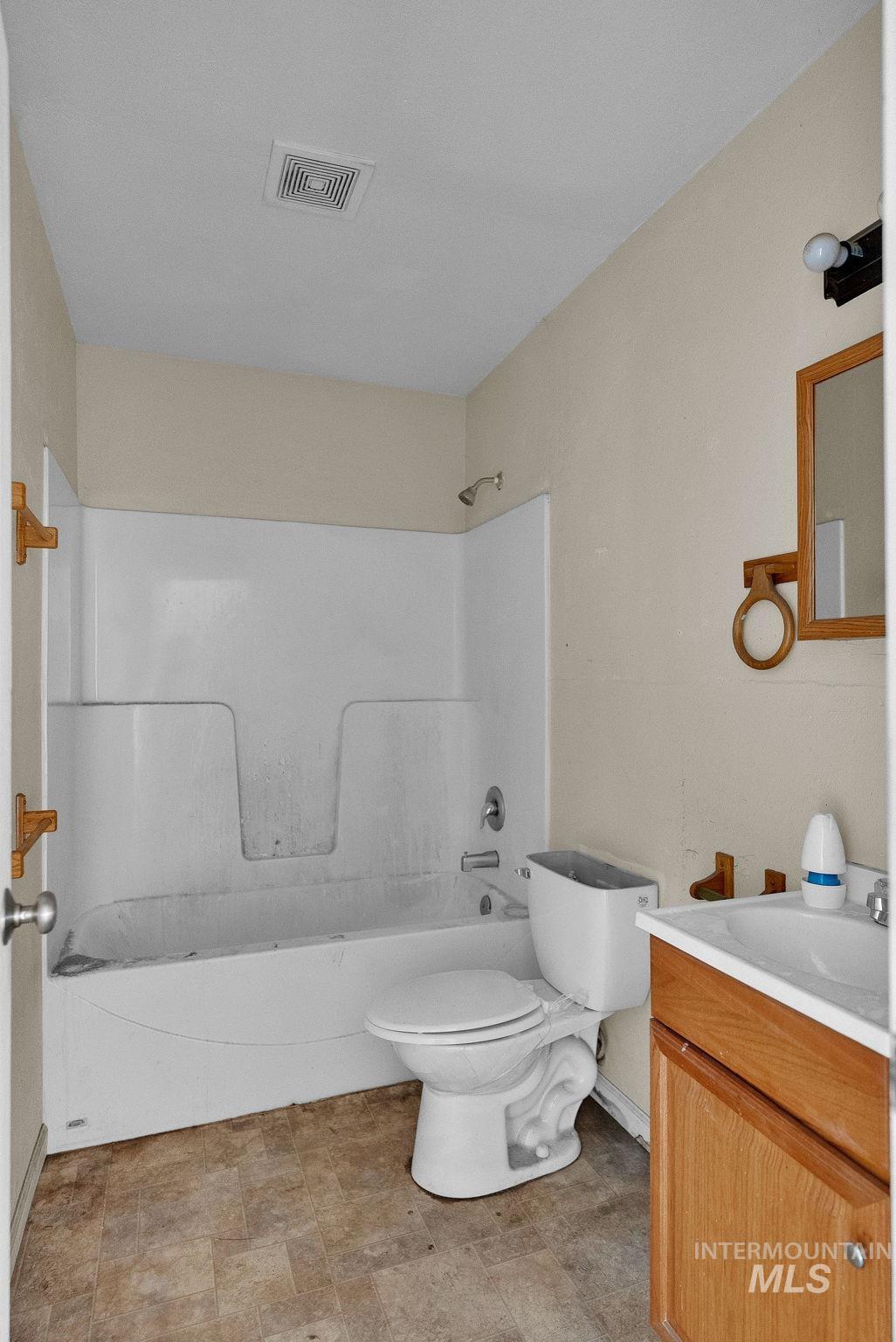 4715 West Reeves Street Coeur D'Alene, ID 83814 - Photo 17 of 24 Full bath with vanity and shower / bath combination