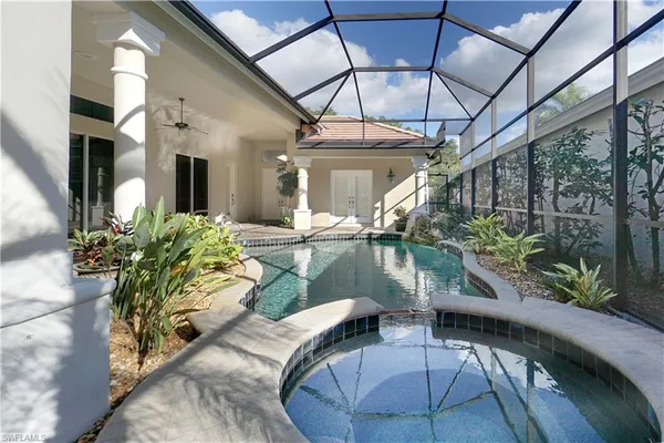 a view of swimming pool with outdoor seating