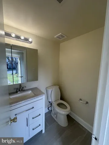a bathroom with a shower and a toilet