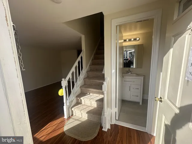 a view of an entryway with wooden floor
