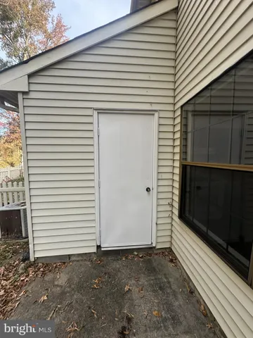 a side view of a house with a garage