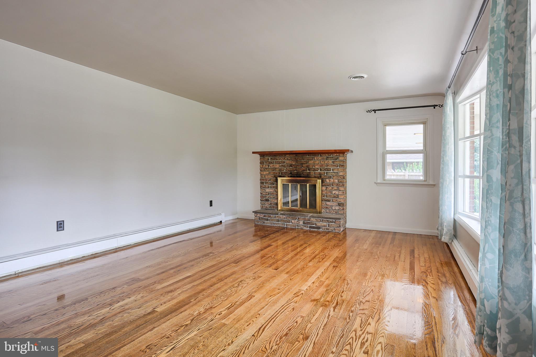 1132 South Forge Road Palmyra, PA 17078 - Photo 2 of 17 Living Room with wood burning fireplace