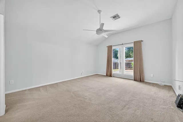 a spacious bathroom with a double vanity sink and a mirror