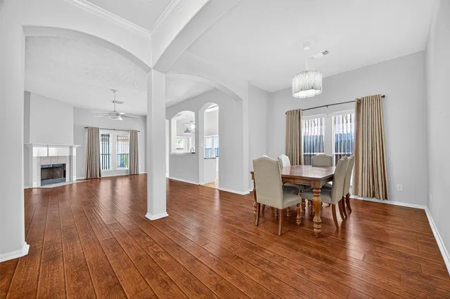 a view of a dining room with furniture and wooden floor