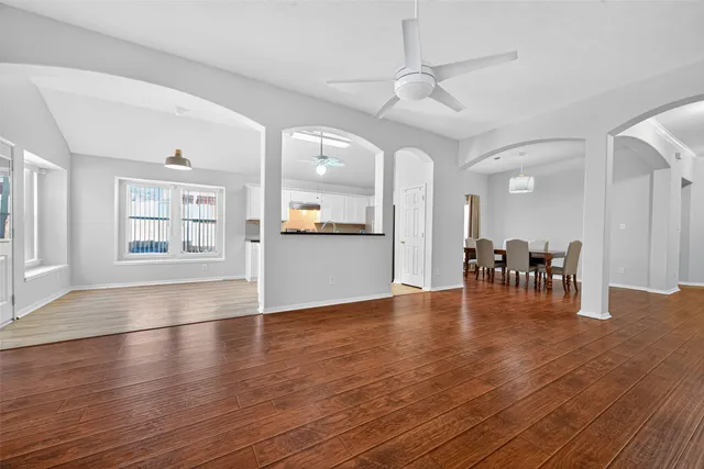 a kitchen with granite countertop a sink cabinets stainless steel appliances and a counter top space