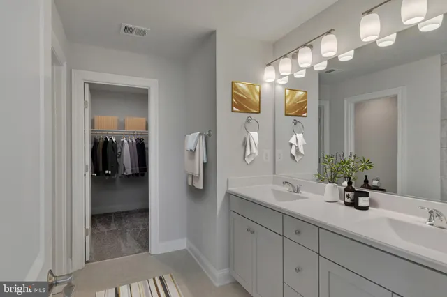 a bathroom with a sink and mirror