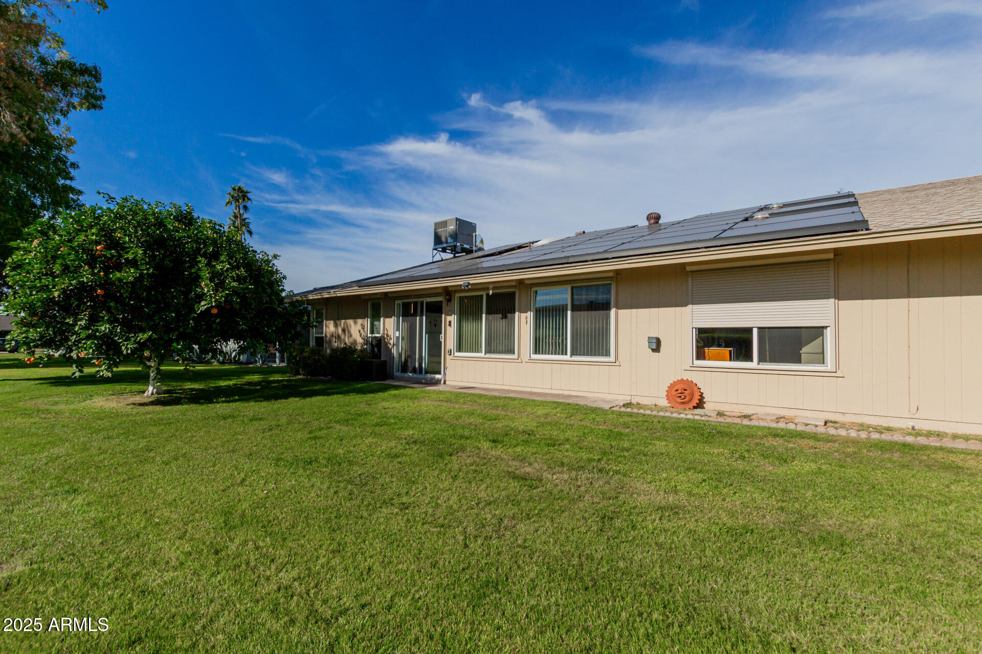10023 West Pleasant Valley Road Sun City, AZ 85351 - Photo 19 of 41 a front view of a house with a garden