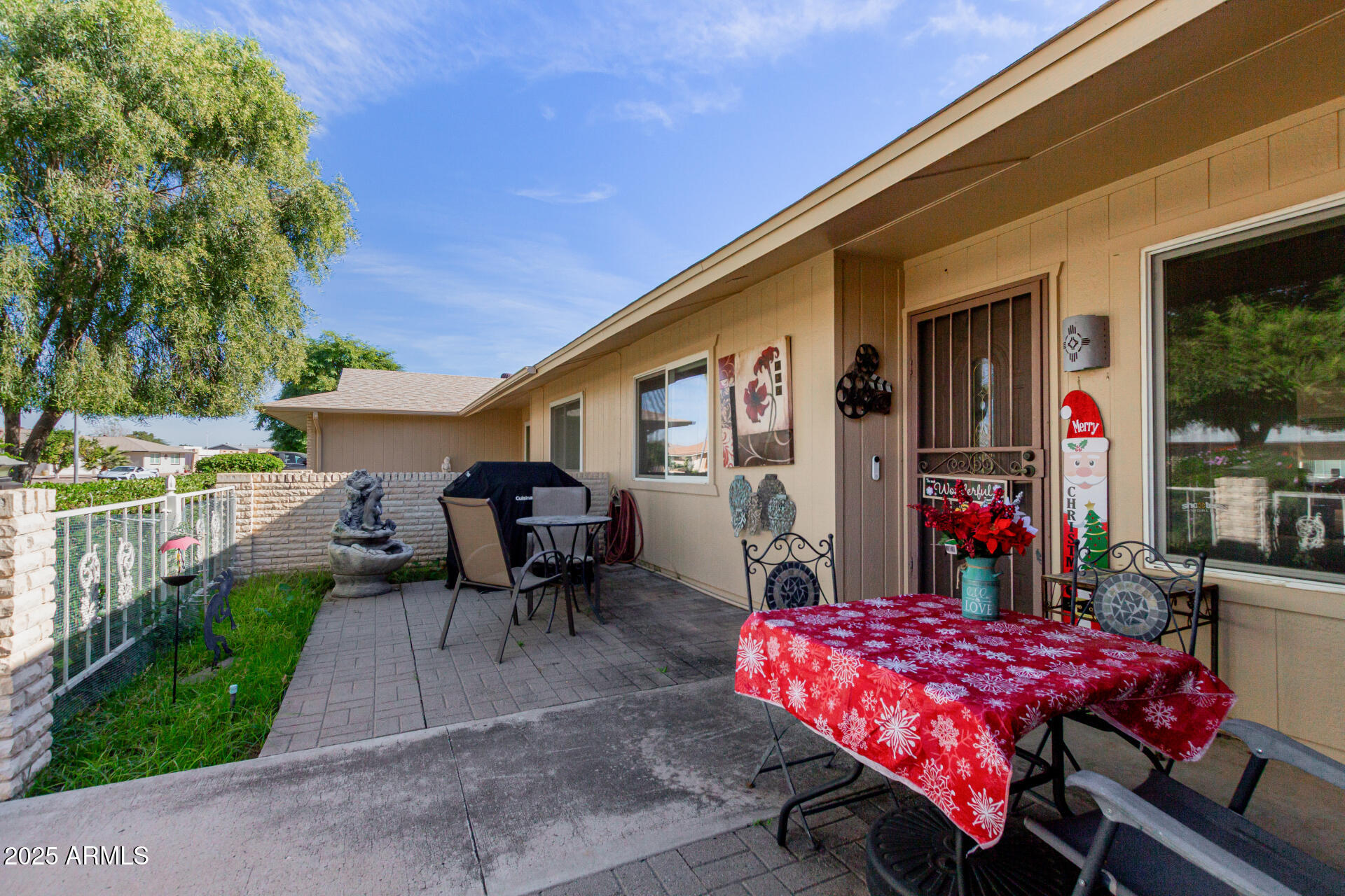 10023 West Pleasant Valley Road Sun City, AZ 85351 - Photo 20 of 41 a front view of a house with patio