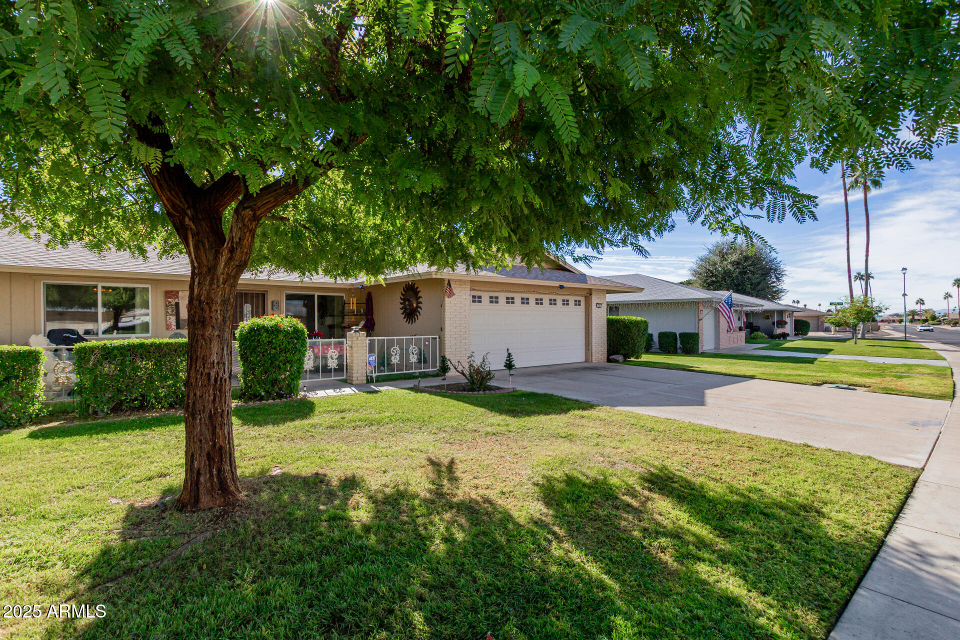 10023 West Pleasant Valley Road Sun City, AZ 85351 - Photo 2 of 41 a front view of house with yard and green space