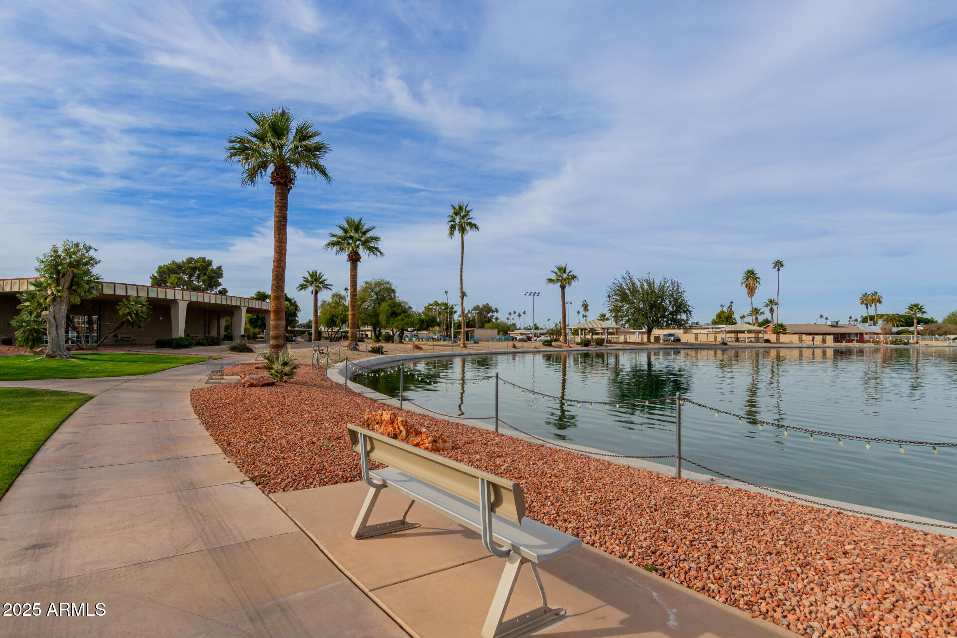 10023 West Pleasant Valley Road Sun City, AZ 85351 - Photo 26 of 41 a lake view with a garden