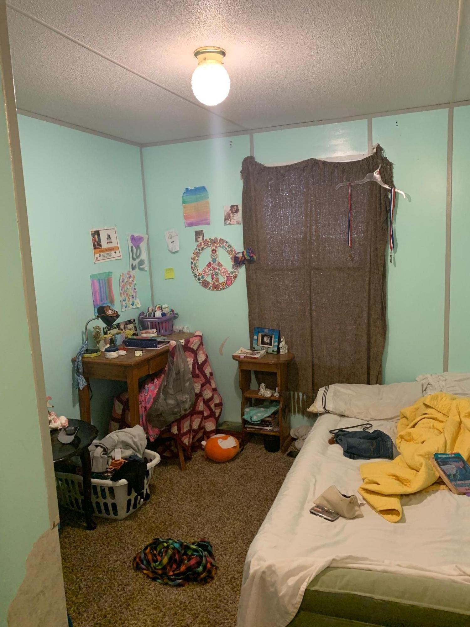 725 Squirrel Road DeFuniak Springs, FL 32433 - Photo 13 of 14 a bedroom with a bed and furniture