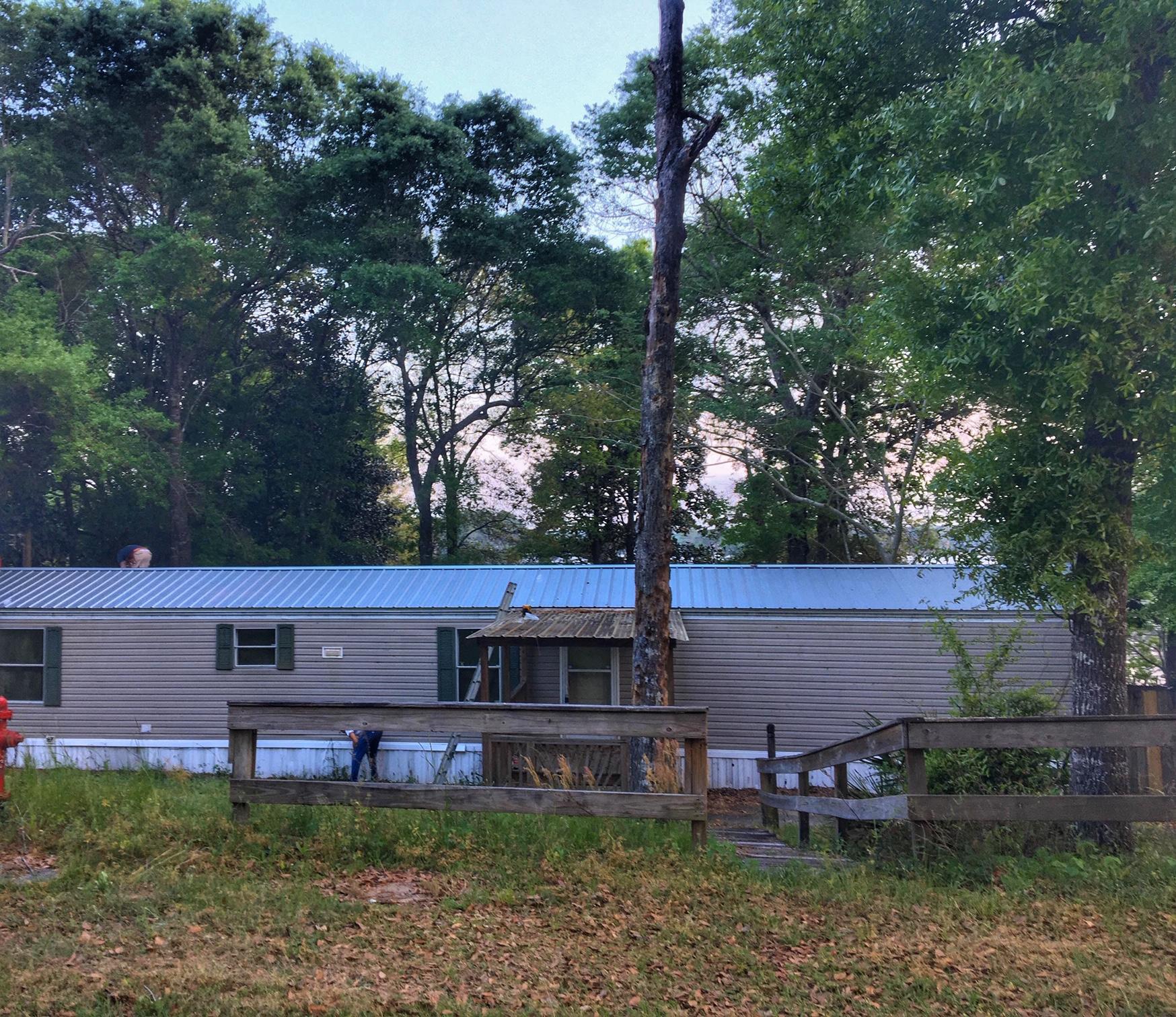 725 Squirrel Road DeFuniak Springs, FL 32433 - Photo 2 of 14 front view of a house with a yard