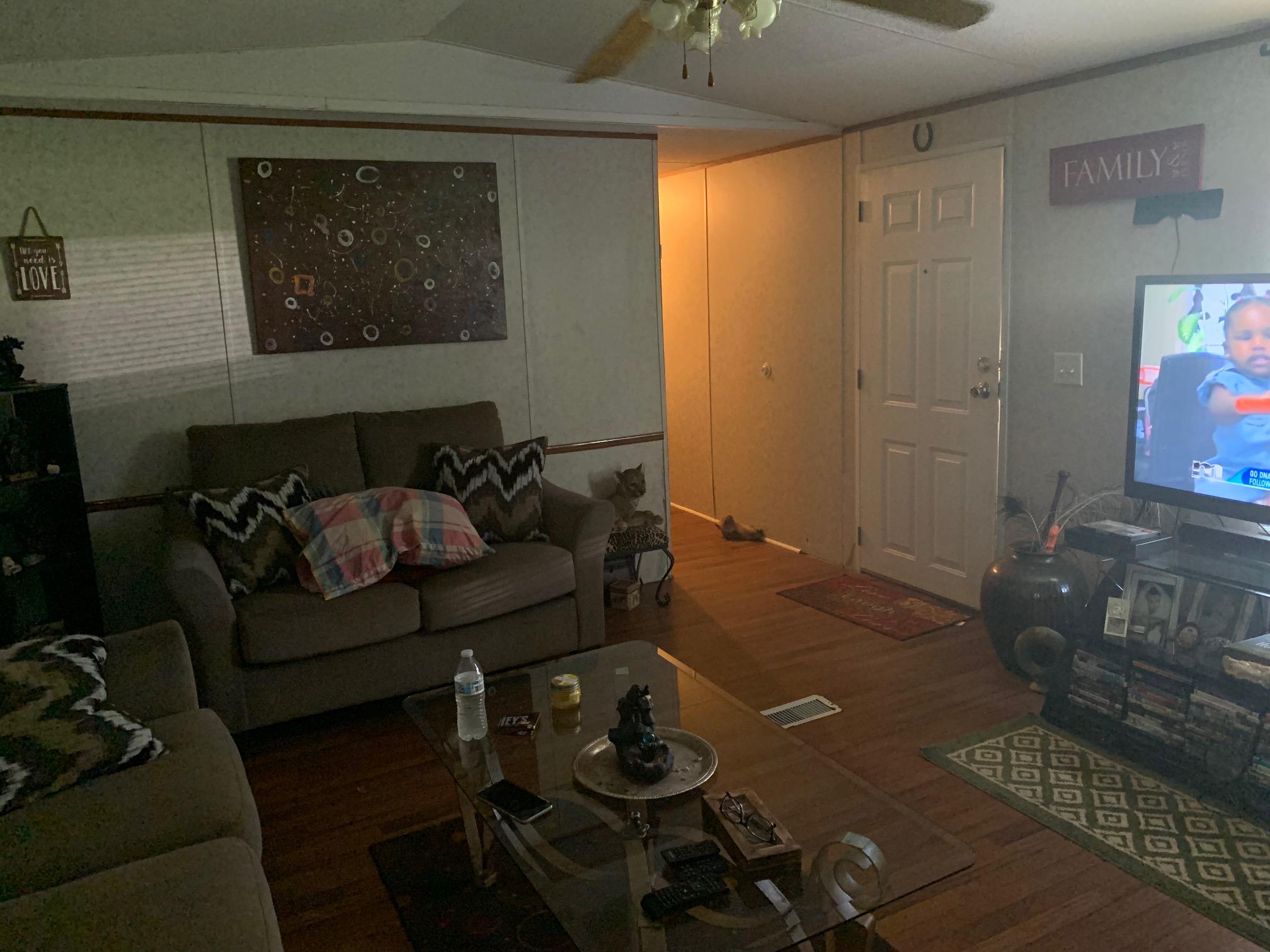 725 Squirrel Road DeFuniak Springs, FL 32433 - Photo 5 of 14 a living room with furniture and wooden floor