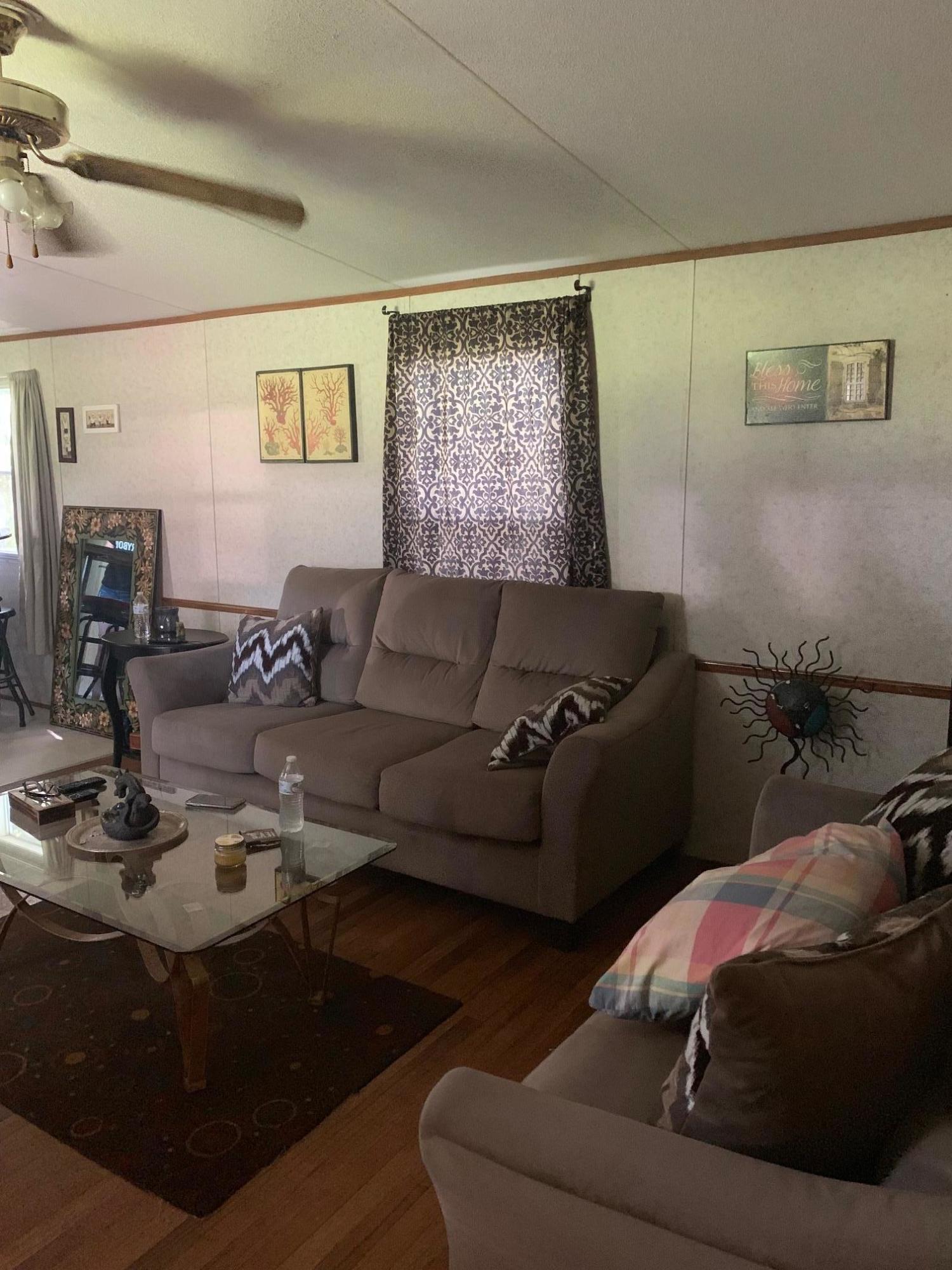 725 Squirrel Road DeFuniak Springs, FL 32433 - Photo 6 of 14 a living room with furniture and a window