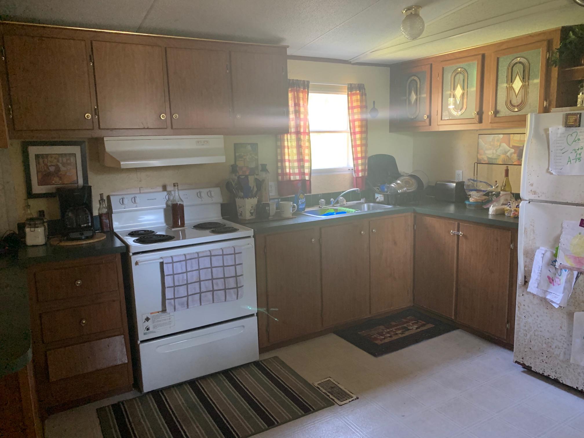 725 Squirrel Road DeFuniak Springs, FL 32433 - Photo 7 of 14 a kitchen with a sink and cabinets