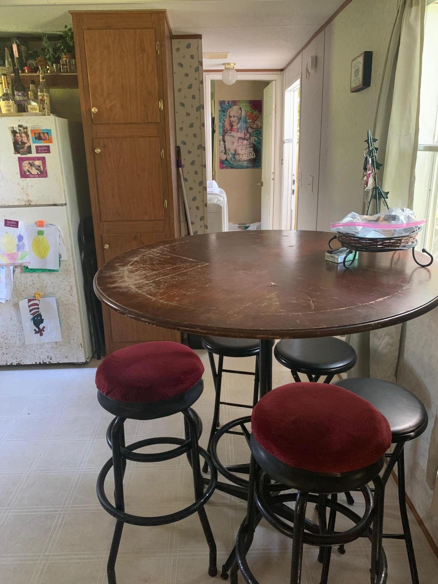 725 Squirrel Road DeFuniak Springs, FL 32433 - Photo 8 of 14 a view of a dining room with furniture and wooden floor