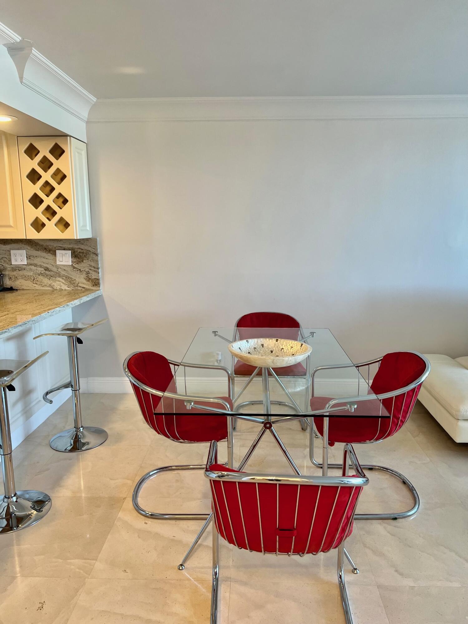 6 Royal Palm Way, Unit 607 Boca Raton, FL 33432 - Photo 5 of 16 a living room with furniture and air hockey table