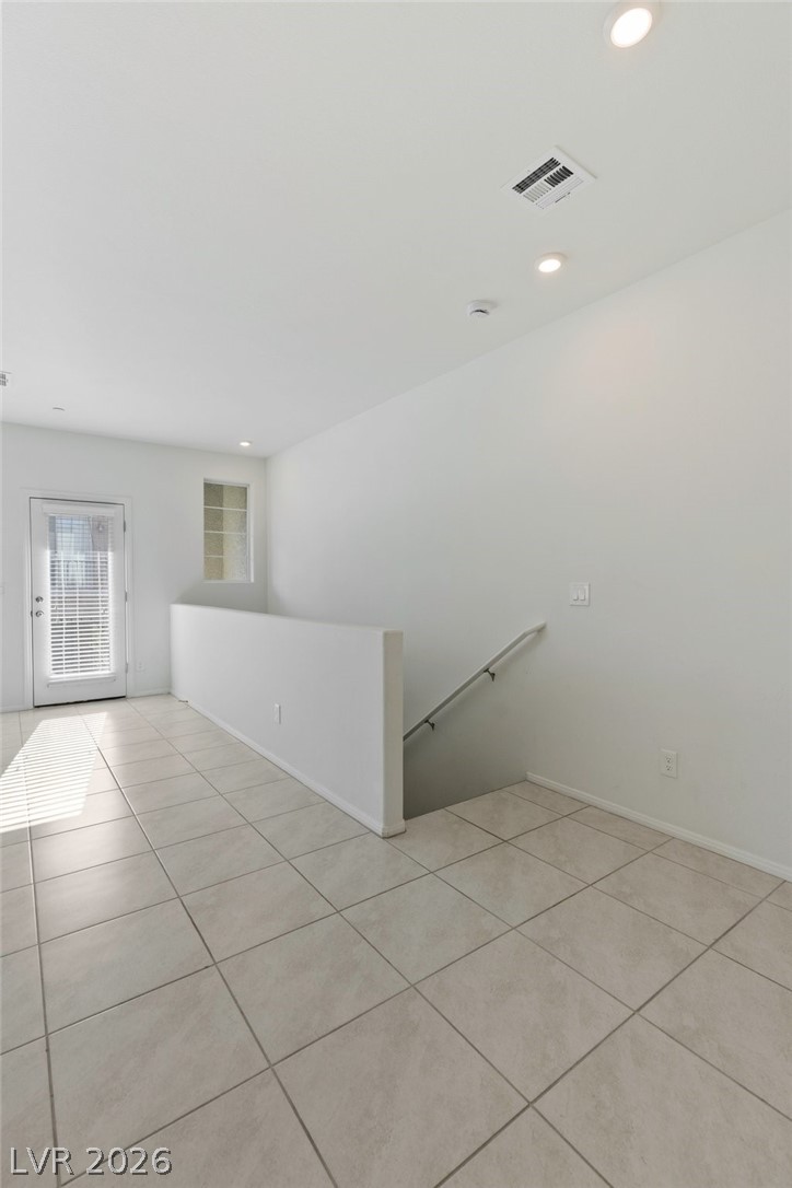6227 Runestone Street Las Vegas, NV 89113 - Photo 26 of 33 Bright and airy interior space with pristine tile flooring and ample natural light.