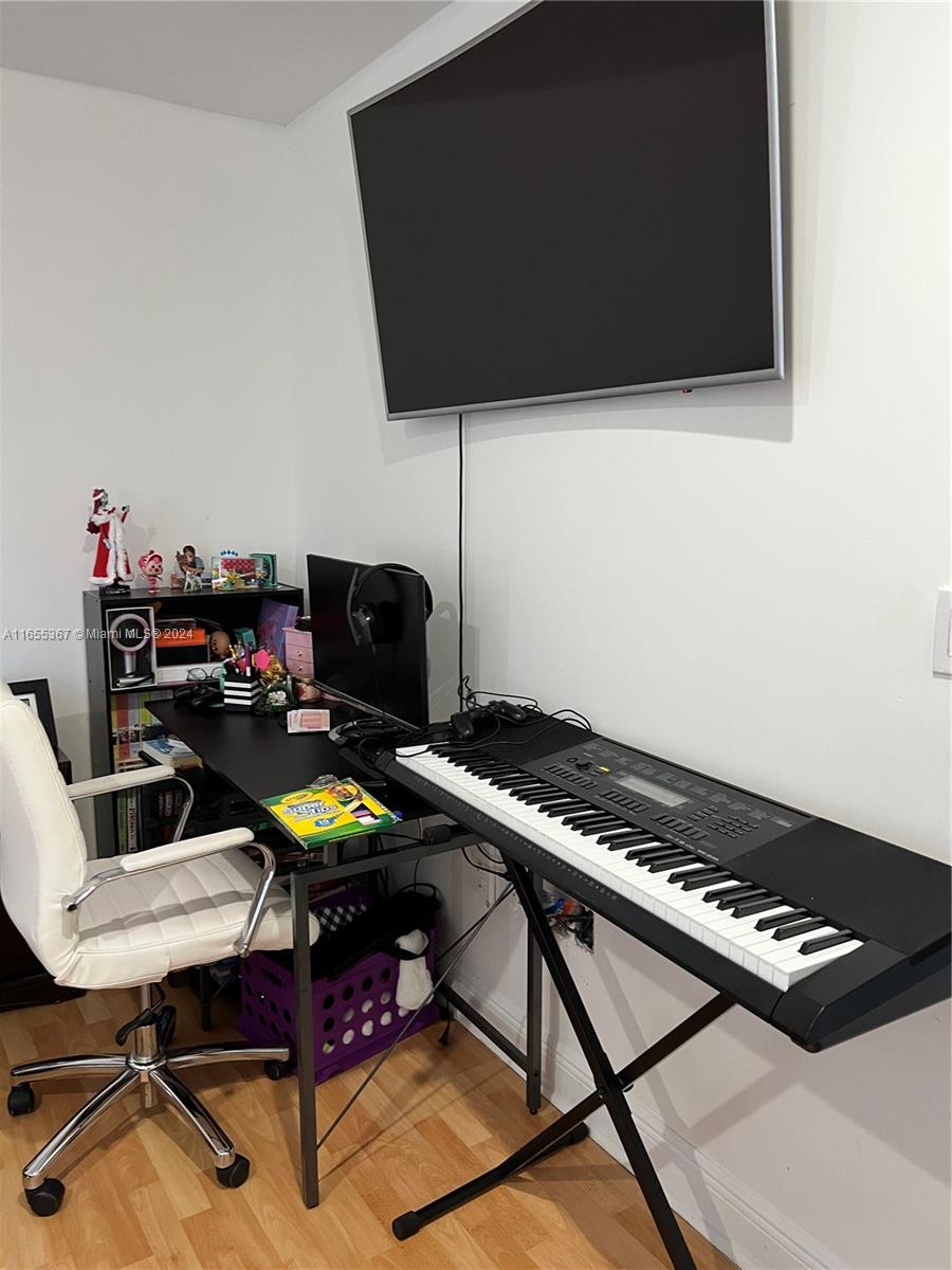 2550 Southwest 27th Avenue, Unit 703 Miami, FL 33133 - Photo 11 of 18 a view of a workspace with furniture