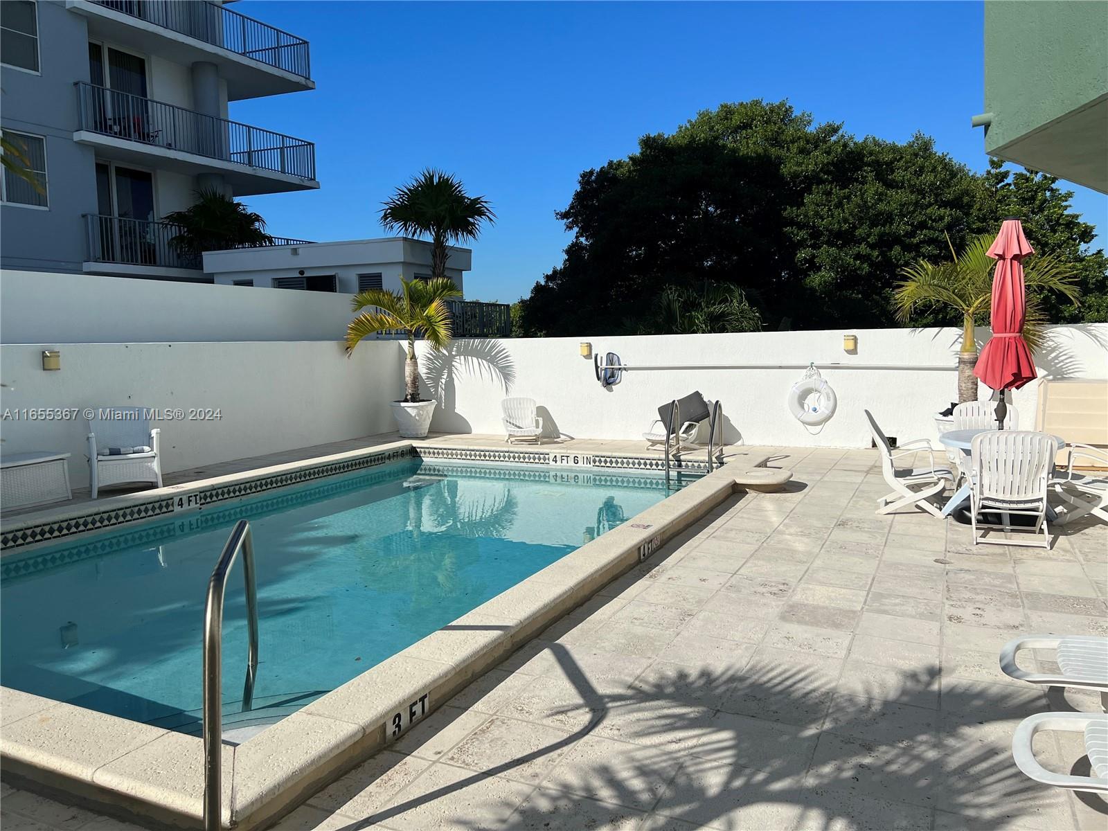 2550 Southwest 27th Avenue, Unit 703 Miami, FL 33133 - Photo 15 of 18 a view of swimming pool from a balcony