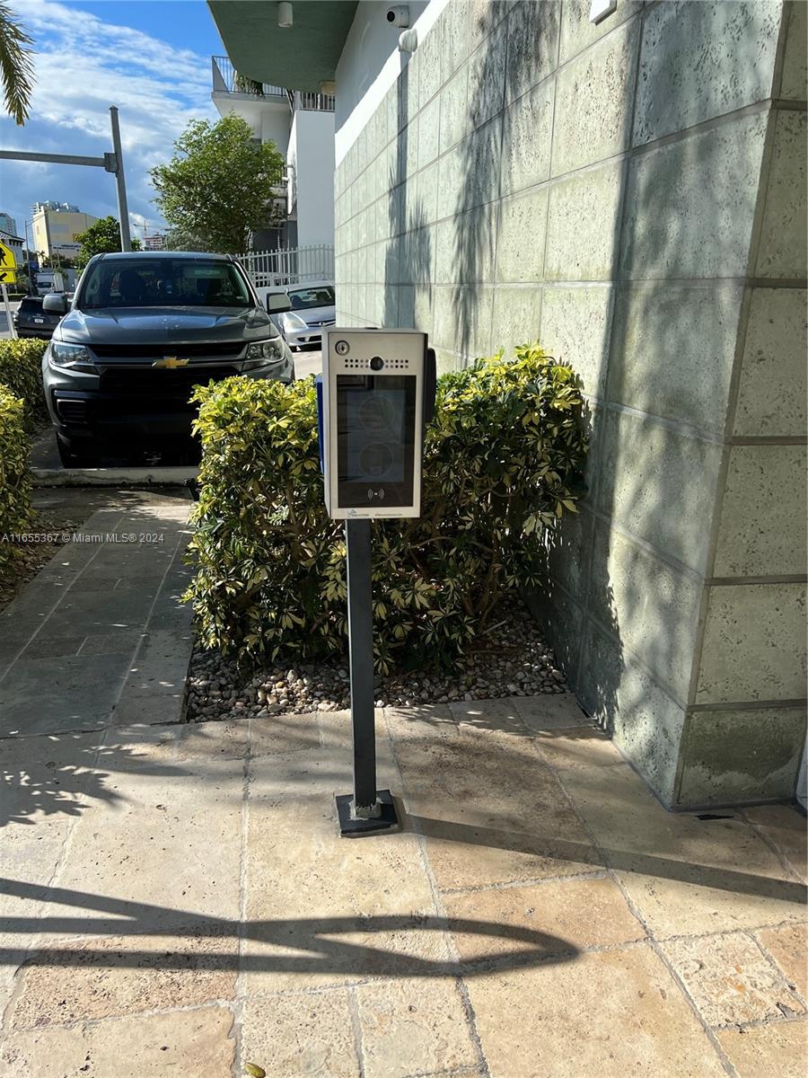 2550 Southwest 27th Avenue, Unit 703 Miami, FL 33133 - Photo 2 of 18 a front view of a house with garden