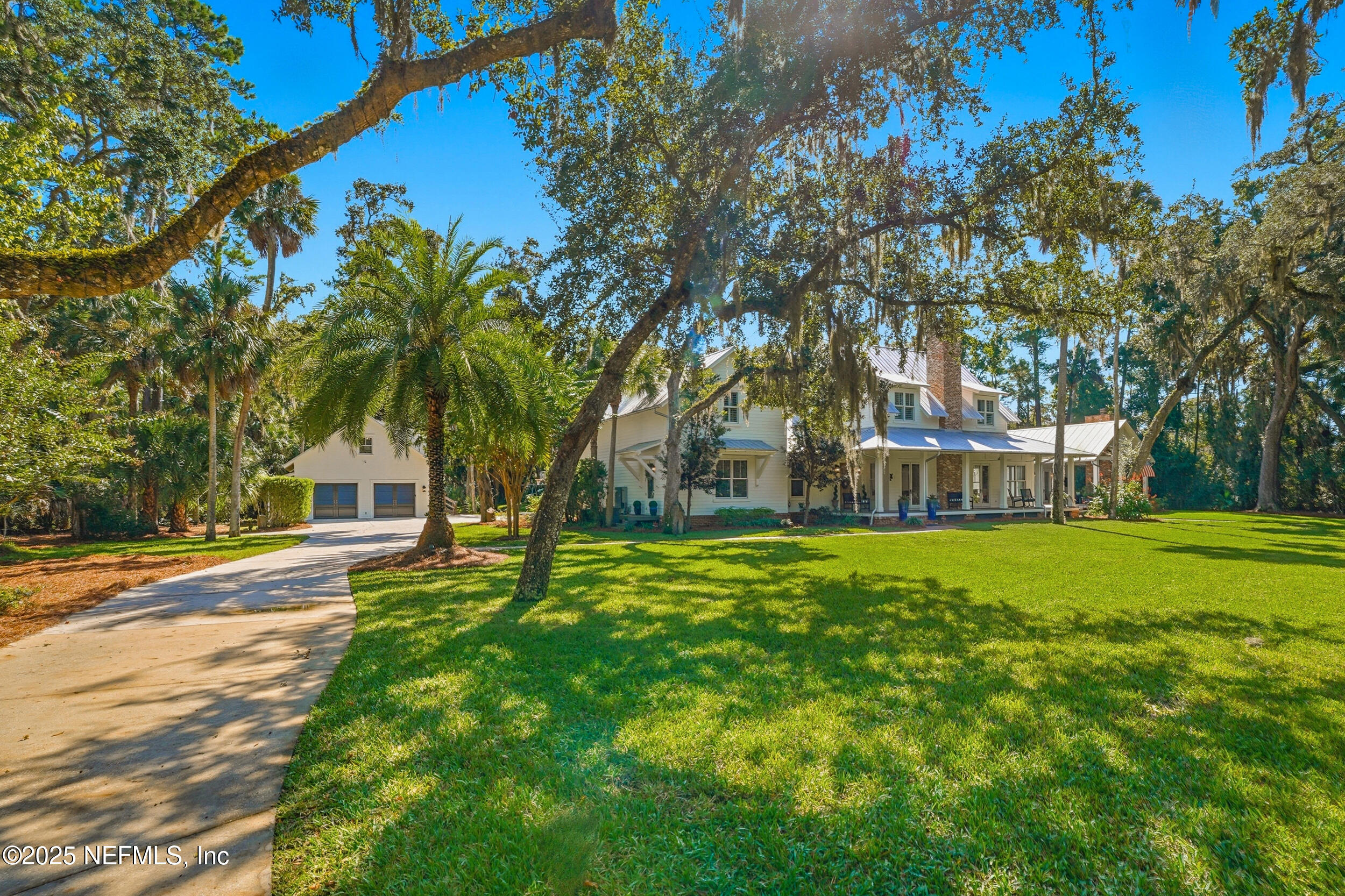 4745 Palm Valley Road Ponte Vedra Beach, FL 32082 - Photo 11 of 104 a front view of a house with yard and green space