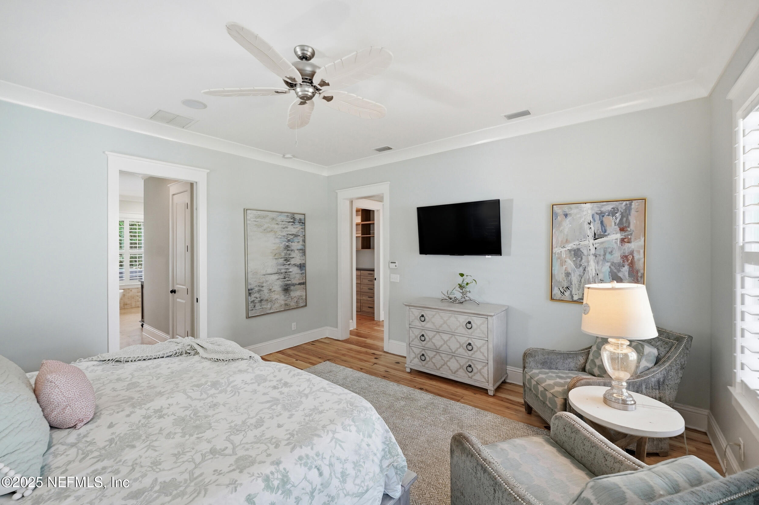 4745 Palm Valley Road Ponte Vedra Beach, FL 32082 - Photo 34 of 104 a spacious bedroom with a bed and a flat screen tv